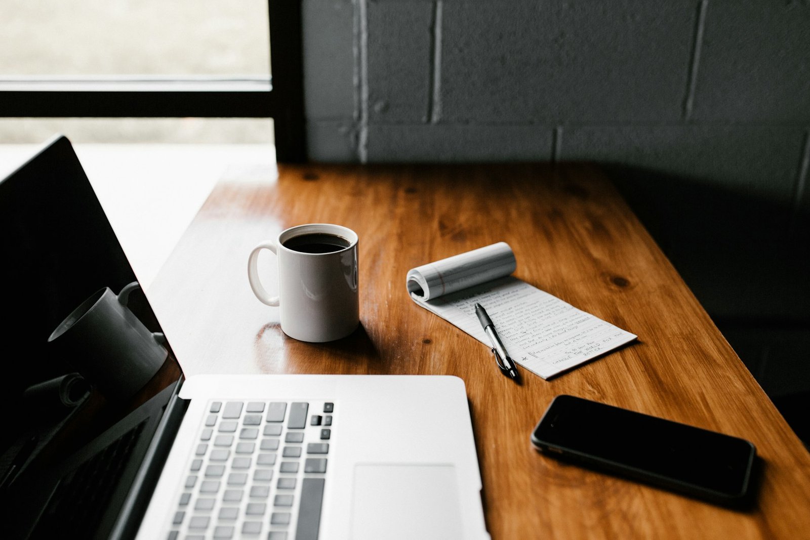 Notebook, planner, and desk tools arranged for routine planning